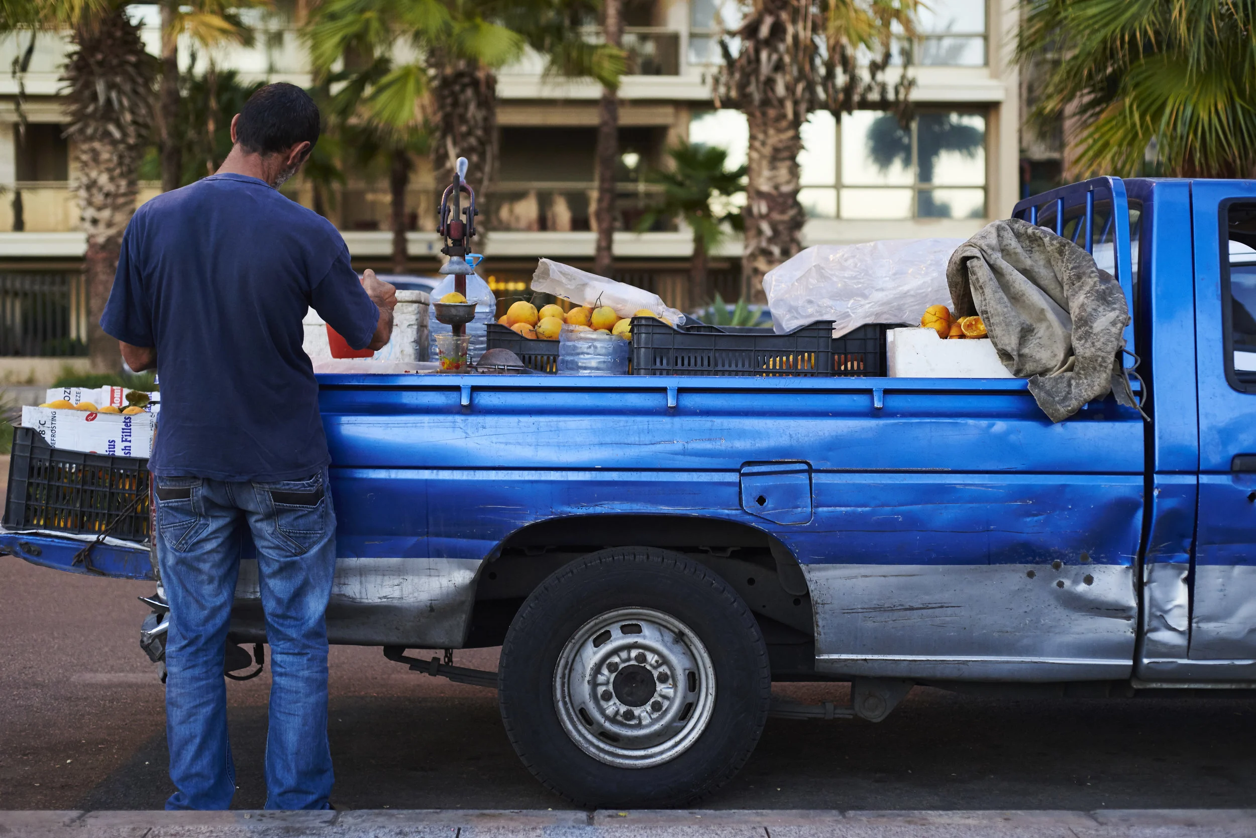 Informal economy in front of the limestone headland of Dalieh al-Raouche, along the Beirut's seashore, Lebanon, 2015.