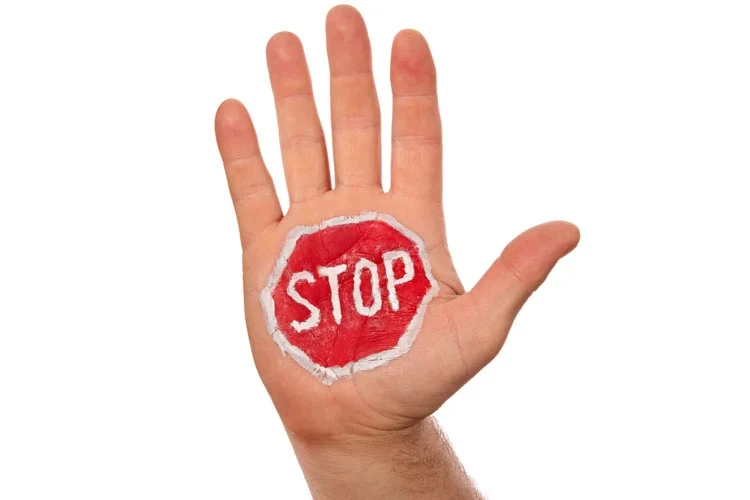hand_with_painted_stop_sign.jpg