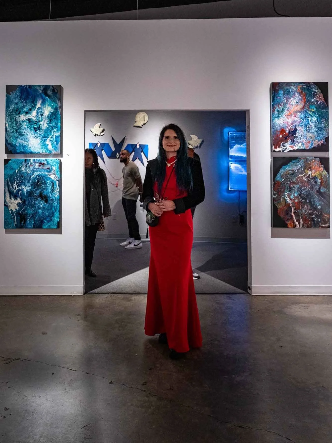 This is Sophia @cosmic_obsidian 

She makes psychedelically abstract works that harness the force of nature atop the canvas in dark hues and bold flashes of color.  These works are now on exhibit and available @kailinart 🍾