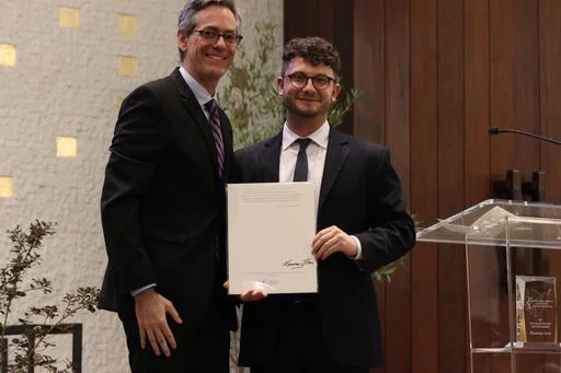 David Myers presents award to Social Justice Fellow Jacob Plitman