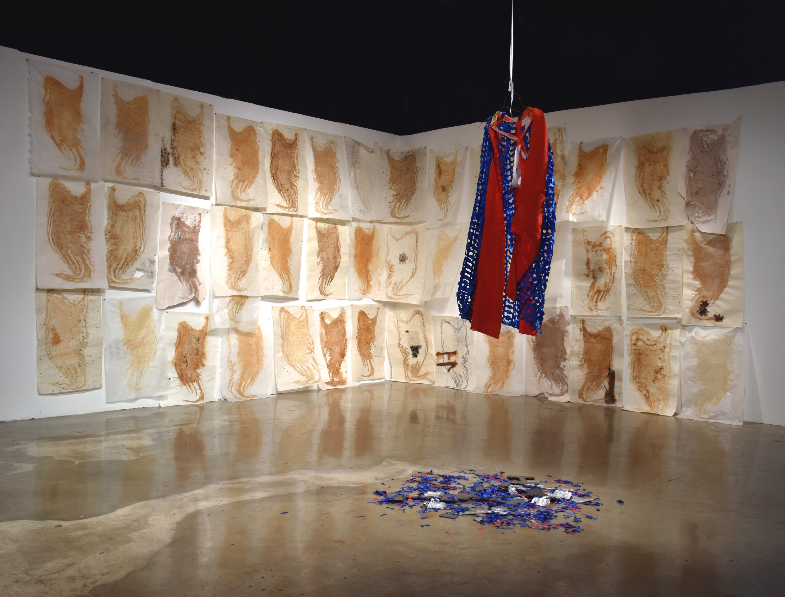 Installation view of Burden (background) and The Lone (Hyper)Vigilante
