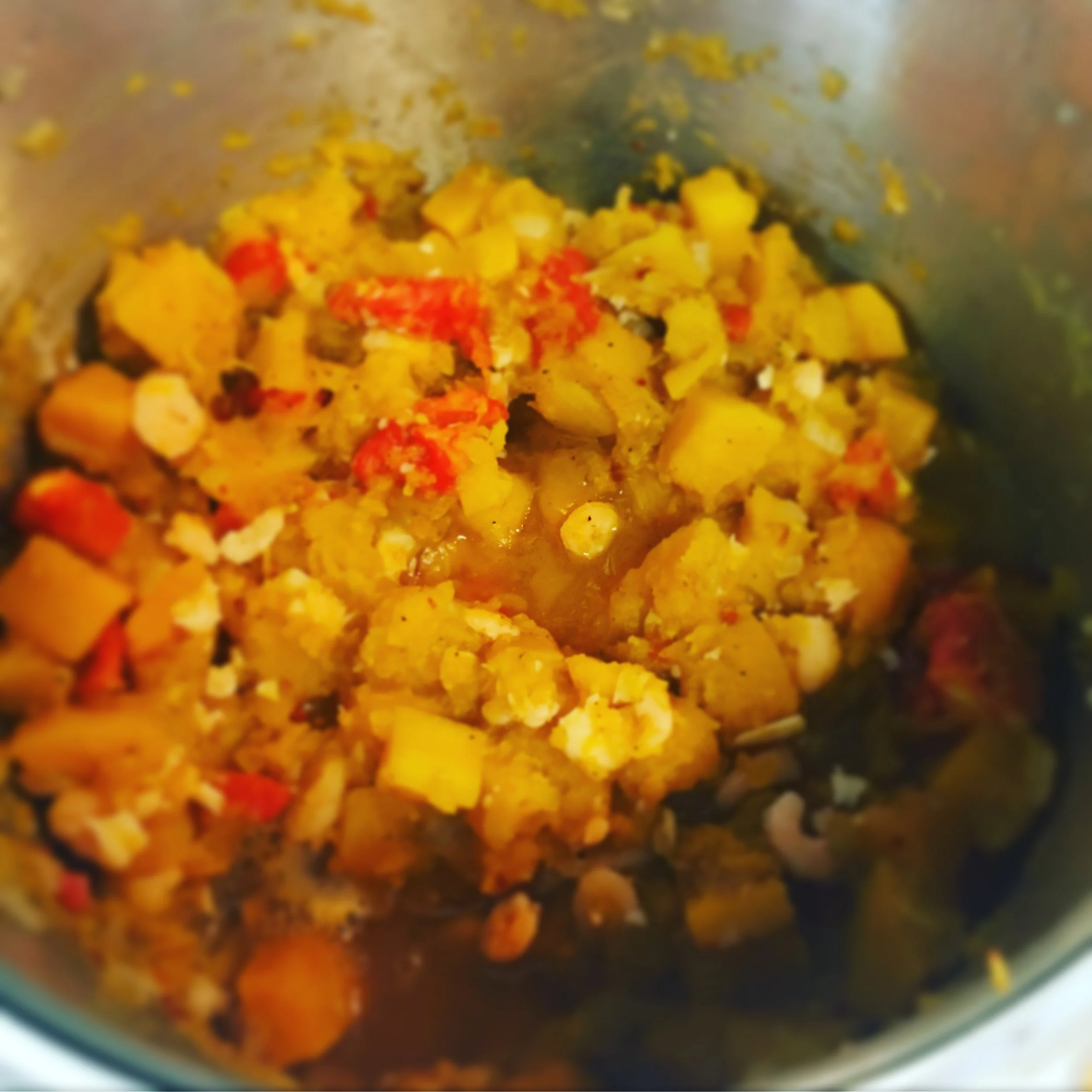 "Pumpkin", or in our case, butternut squash with onions, garlic, tomatoes, mini shrimp, some cumin, salt and pepper, a bit of sugar.