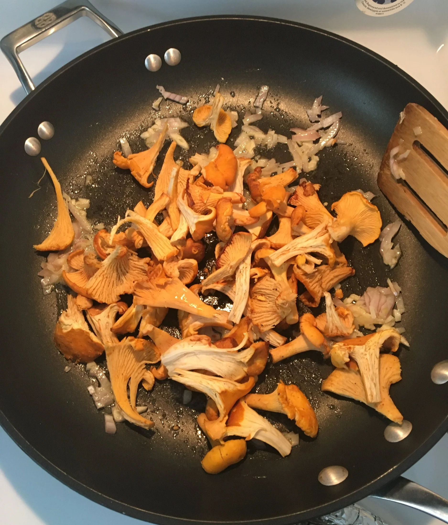 Chanterelles in the pan with shallots, garlic and a good pat of butter.