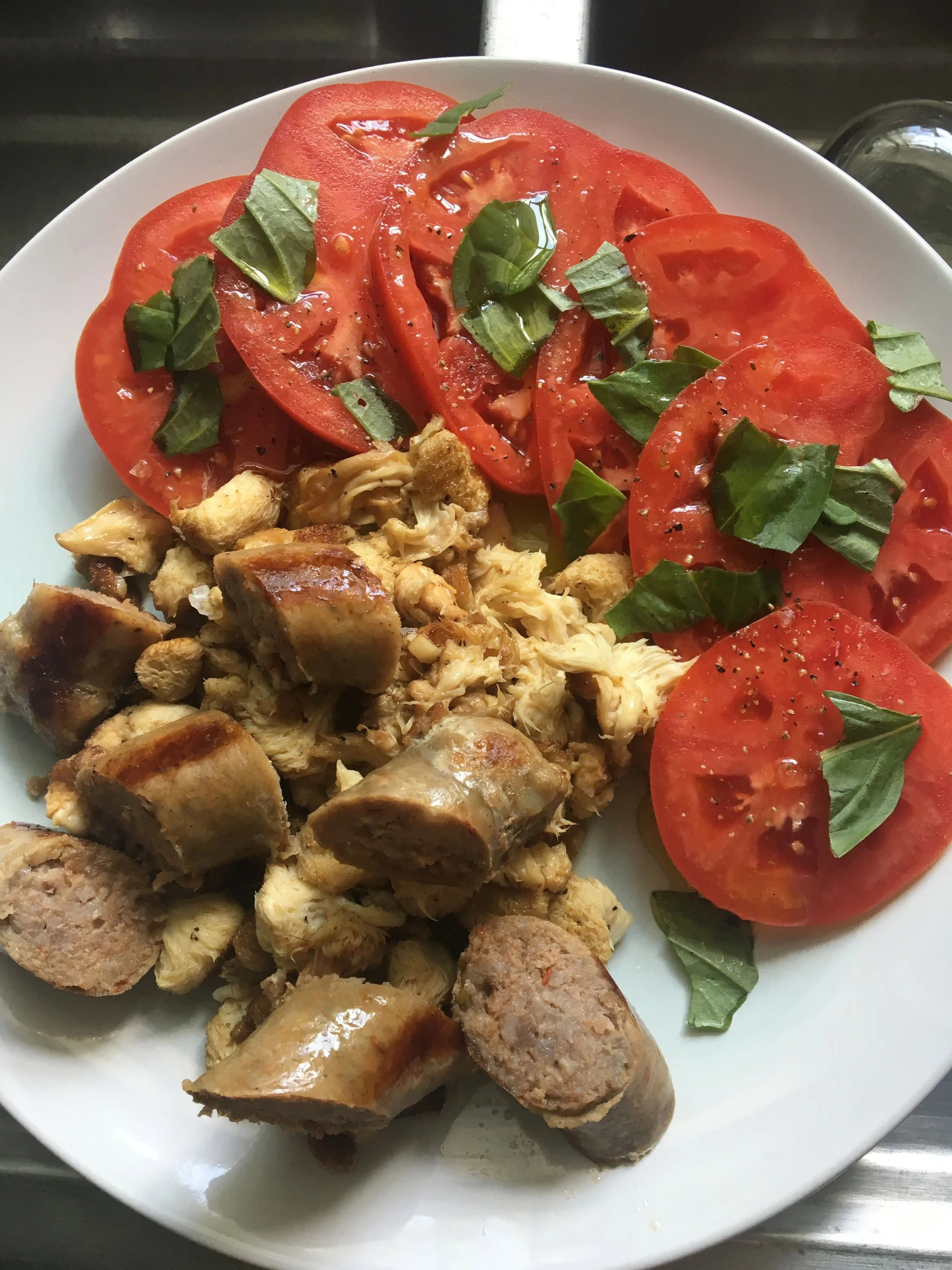 Lion's Mane sautéed with Savannah River Farms sausage and local organic tomatoes and Canewater Farm organic basil for lunch.