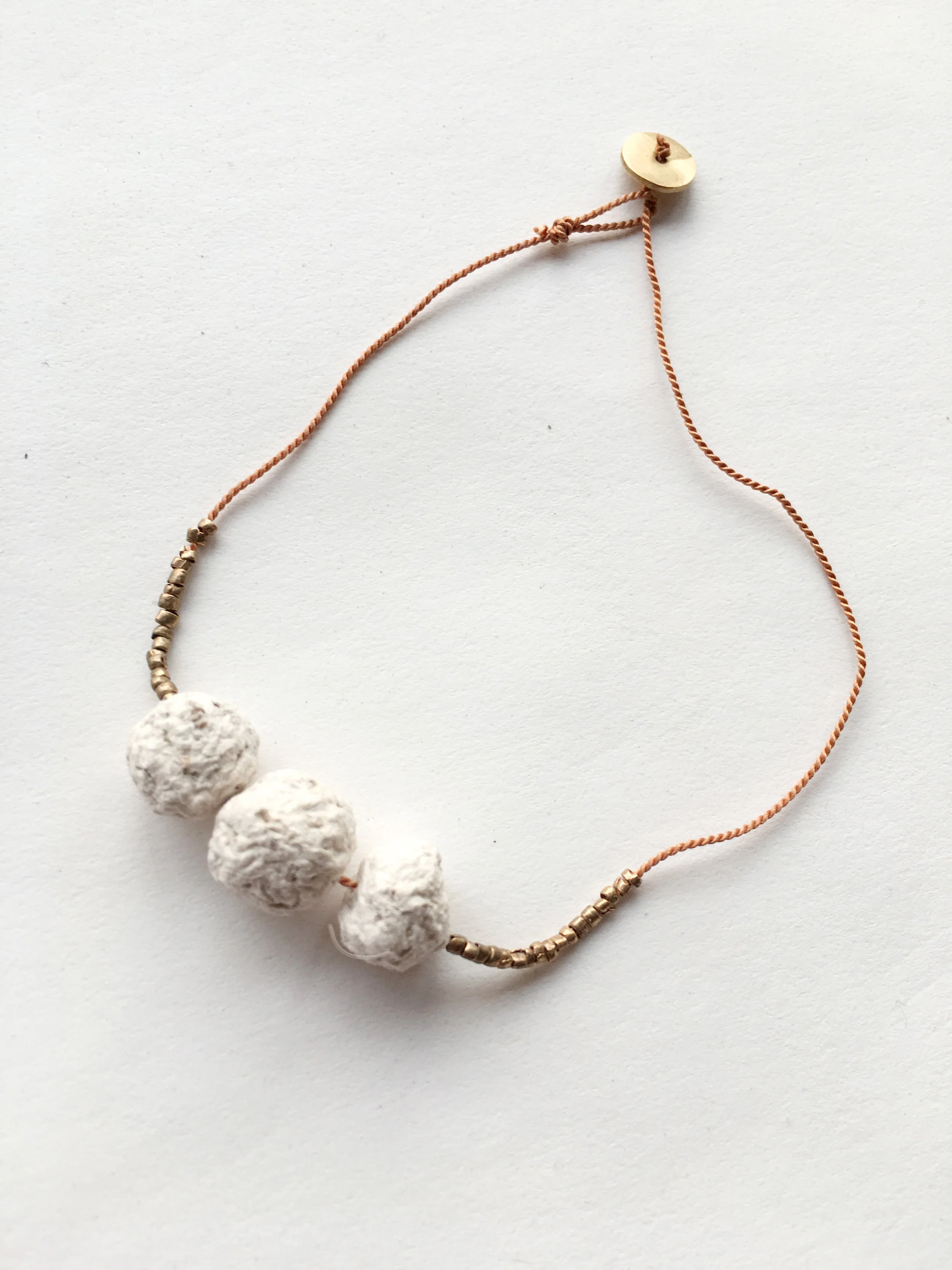  The beads on this bracelet are tiny seed bombs in disguise. Unlike traditional seed bombs that are made of unfired clay, these are made of paper and allow you to wear it without getting dirty. They are also very light and durable and can even get a 