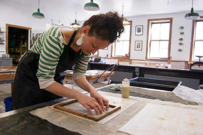 Jody working in the paper making studio at the Women's Studio Workshop. Photo courtesy of Women's Studio Workshop . 