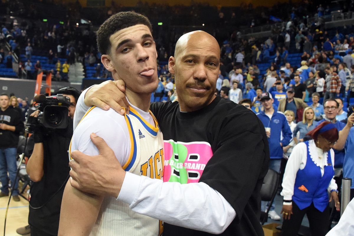 When the father of NBA prospect Lonzo Ball by the name of Lavar Ball surfaced, I really didn't pay him too much mind and didn't see what all the hate and derision was about. He was a black father who's been involved in his kids' lives (maybe a little too involved, but involved nonetheless) who was extremely proud of what his sons have accomplished (albeit, not much) and very confident in what his sons will accomplish in the future. No harm, no foul, right? I mean we live in an age where schmucks are famous and celebrated for nothing but being rich, so who's this guy really hurting?! But, after a few weeks of watching Lavar Ball's behavior, and most recently the "release" of the prototype of his son's sneaker which came with a five hundred dollar price tag, I have to say- I'm really starting to hate this clown. When asked on a radio show to explain the steep price of the shoes, he only said "That's what I felt they are worth." I was expecting him to reveal that there was some sort of space age technology built into the shoe to help athletes perform better, or at least some powder cocaine tucked away in a zip pocket of the shoe to help you think you could run faster and jump higher...but nope, just a "I wanna rack up!" explanation. But, if you ain't "baller" enough to afford these unimpressive, don't-even-have-ankle-support, rip offs, you can buy a pair of the even more unimpressive Big Baller Brand flip flops for just $220!!! SMH. Never mind the fact his son hasn't even been drafted into the NBA yet to play a single game and didn't even make it to the Final Four in the NCAA tournament, his middle son isn't even that good, & his youngest son is still in high school.... he's gonna charge over triple the amount of the shoes that carry the name of the best basketball player to ever step on the court, who actually has rings, and a solidified legacy!!!!! This isn't about being a proud father. This is not about his sons and securing their future. This is about greed. This is about celebrity. And above all, this is about him . And it kind of always has been about him. From him going on various sports shows to promote his Big Baller Brand, to him claiming he would slay Micheal Jordan in a one-on-one game, to him claiming his sons are way better than the current crop of NBA all stars, to blaming UCLA's loss on the white players... its all about getting himself attention and in front of the cameras. He's even revealed that he's aiming to land himself his own reality show. This clown is bad is for basketball, bad for his sons' potential careers, and bad for the public image of black fathers. Its great that his his sons are likely not going to become statistics to the streets, but when Lavar publicly makes statements that his sons will never be able to live up to, and scares away endorsements when companies don't want to invest with his Big Baller Brand, he's only doing damage that's going to be hard to get undone. He makes it seem as if black fathers are only involved in their kids' lives when they are top NBA prospects and potential cash cows. He also makes his sons targets for when they do get their careers going. At best, he comes off as a failed athlete himself who's reliving his glory days by vicariously living through his sons who are going to redeem the Ball family name. At worst, he comes off as a boisterous, ignorant, loud mouth, greedy Negro who's trying his best to pimp out his kids. And right now, I just want him to go away. And take those ugly shoes with him. 