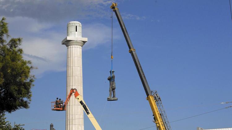 General Lee being knocked off his pedestal. (Scott Threlkeld/AP)