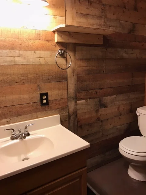 After: New wood paneling and painted floor.