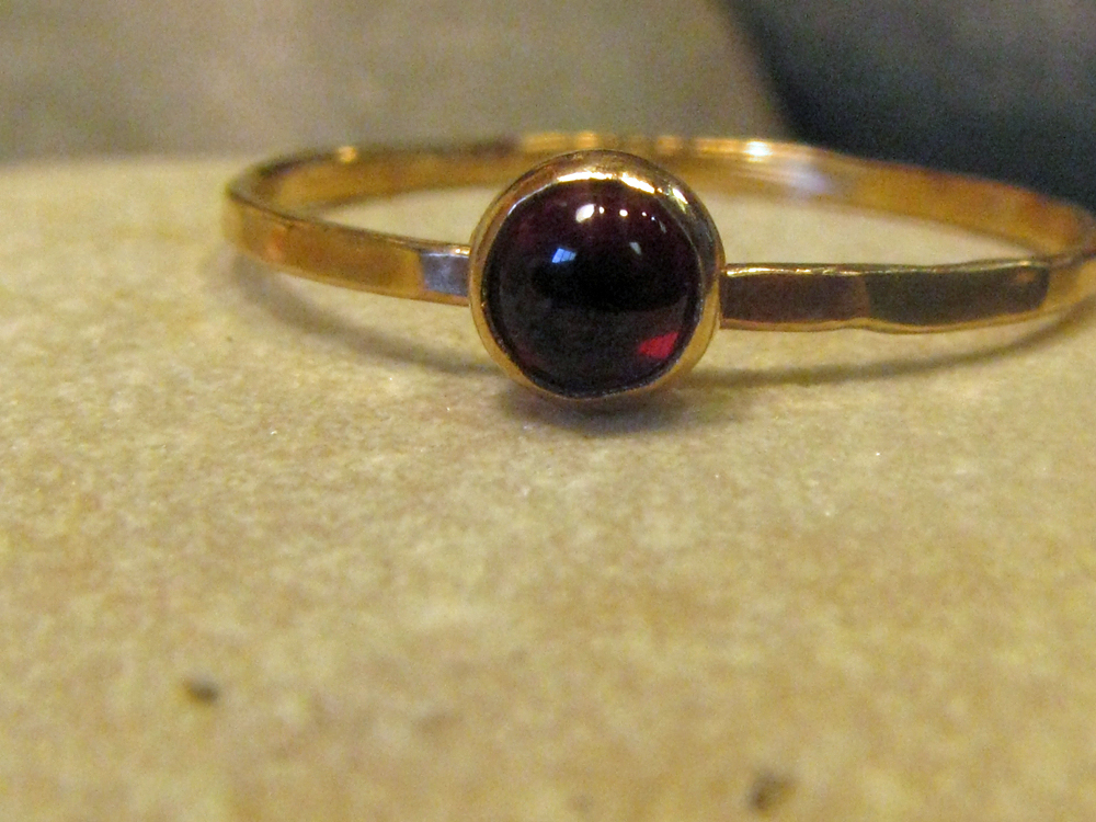 14k gold ring with natural garnet.