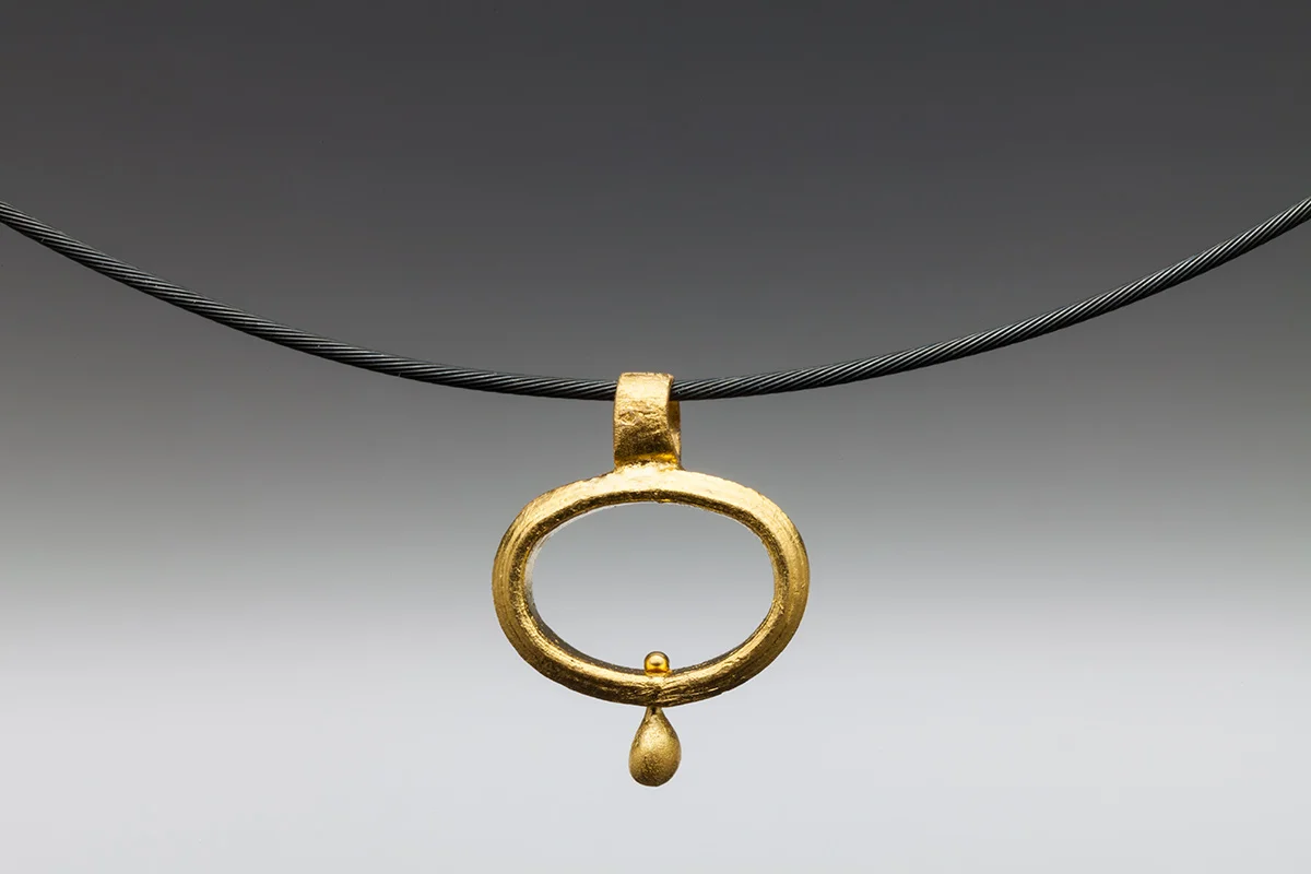 22k oval teardrop pendant. one of a kind