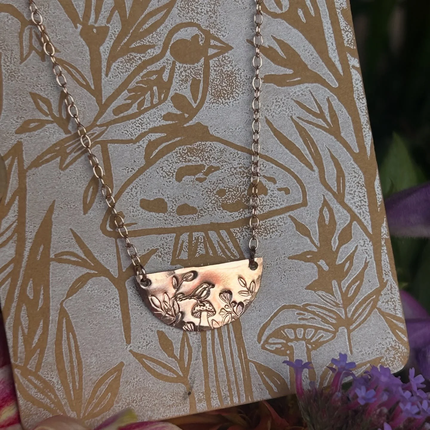 What does one do when a forgotten block print/jewelry card is found in the shop? One that I made long ago from some of my favorite elements from nature - carefully hand-carved inside my home studio? 🍄🐦&zwj;⬛🌸🌿 Stamp a special necklace to pair wit