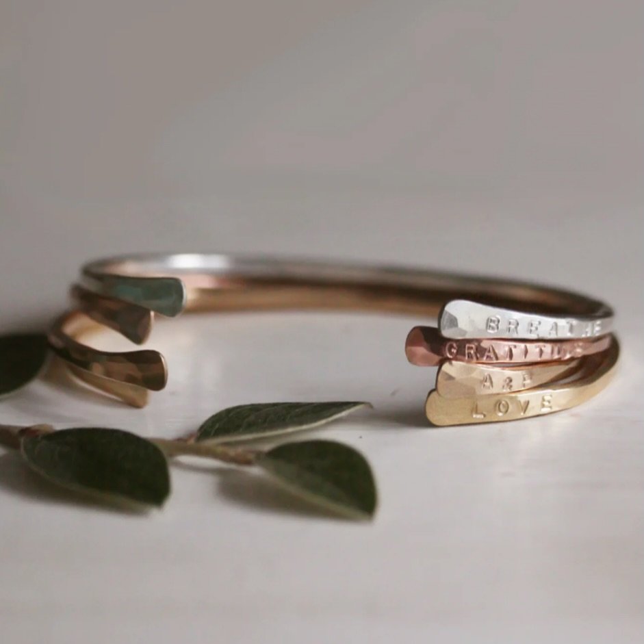 Words are personal. They can heal, inspire and move us. They can represent our inner desires and internal commitments. Keep your personal words close at hand {and engraved upon your heart} by wearing them on the inside (or outside!) of these adjustab