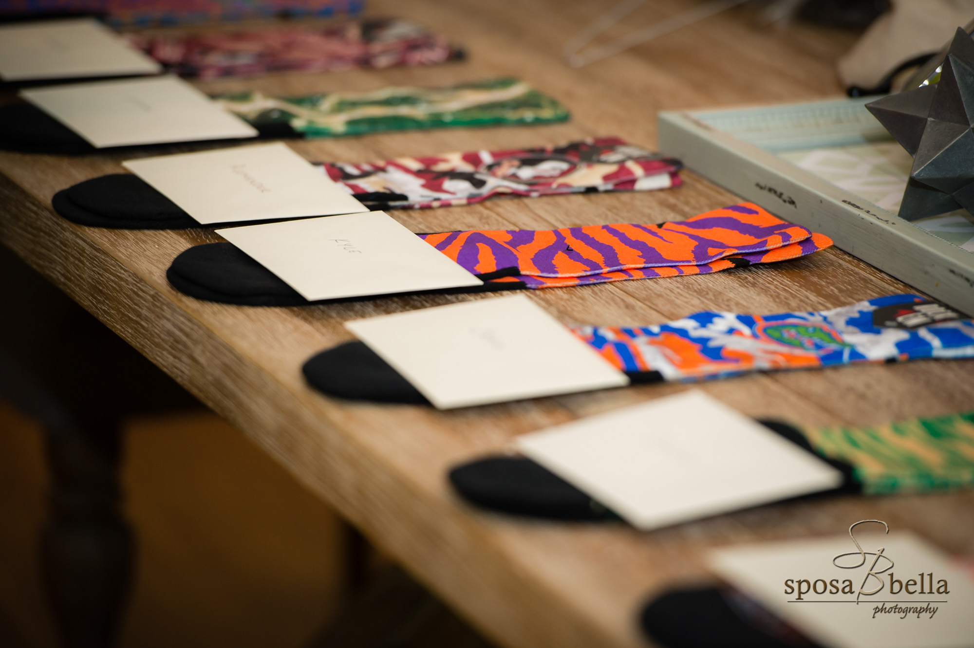 Each groomsman was given a pair of socks to show off each of their different personalities. This is a great way to add a little personalization to the groomsmen attire.