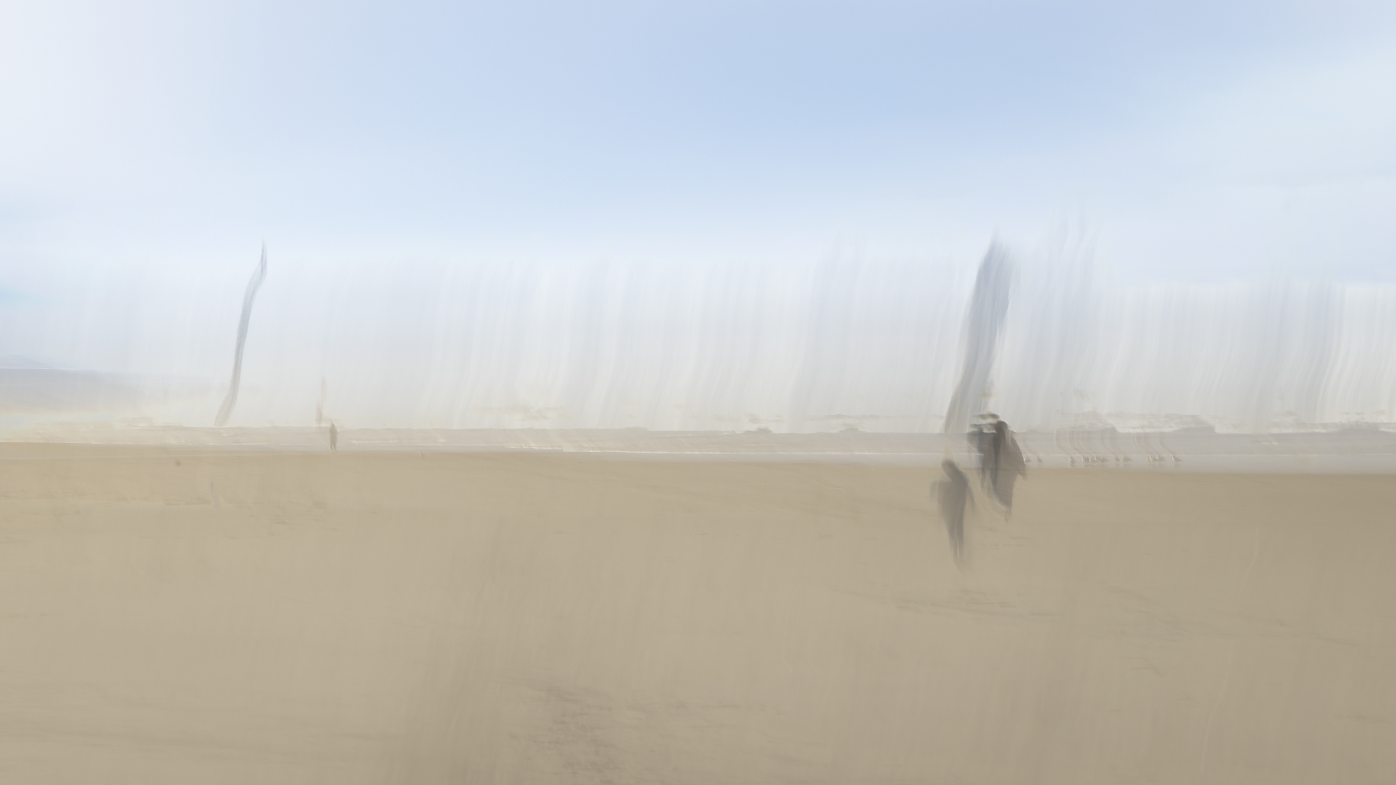 Atmospheric, impressionistic ICM beach photograph with ghosted figures in fog, motion blur creating coastal meditation on memory and place