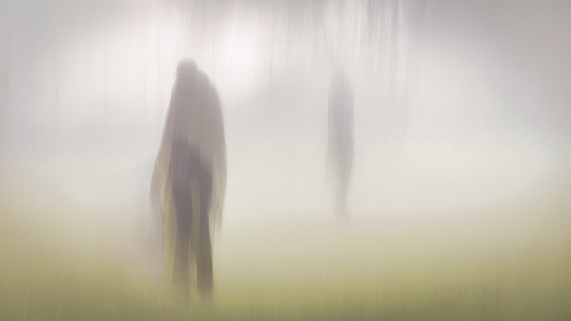 Atmospheric, impressionistic ICM photograph with ghosted figures in dense fog, multiple exposure exploring abandonment and fading presence in muted tones