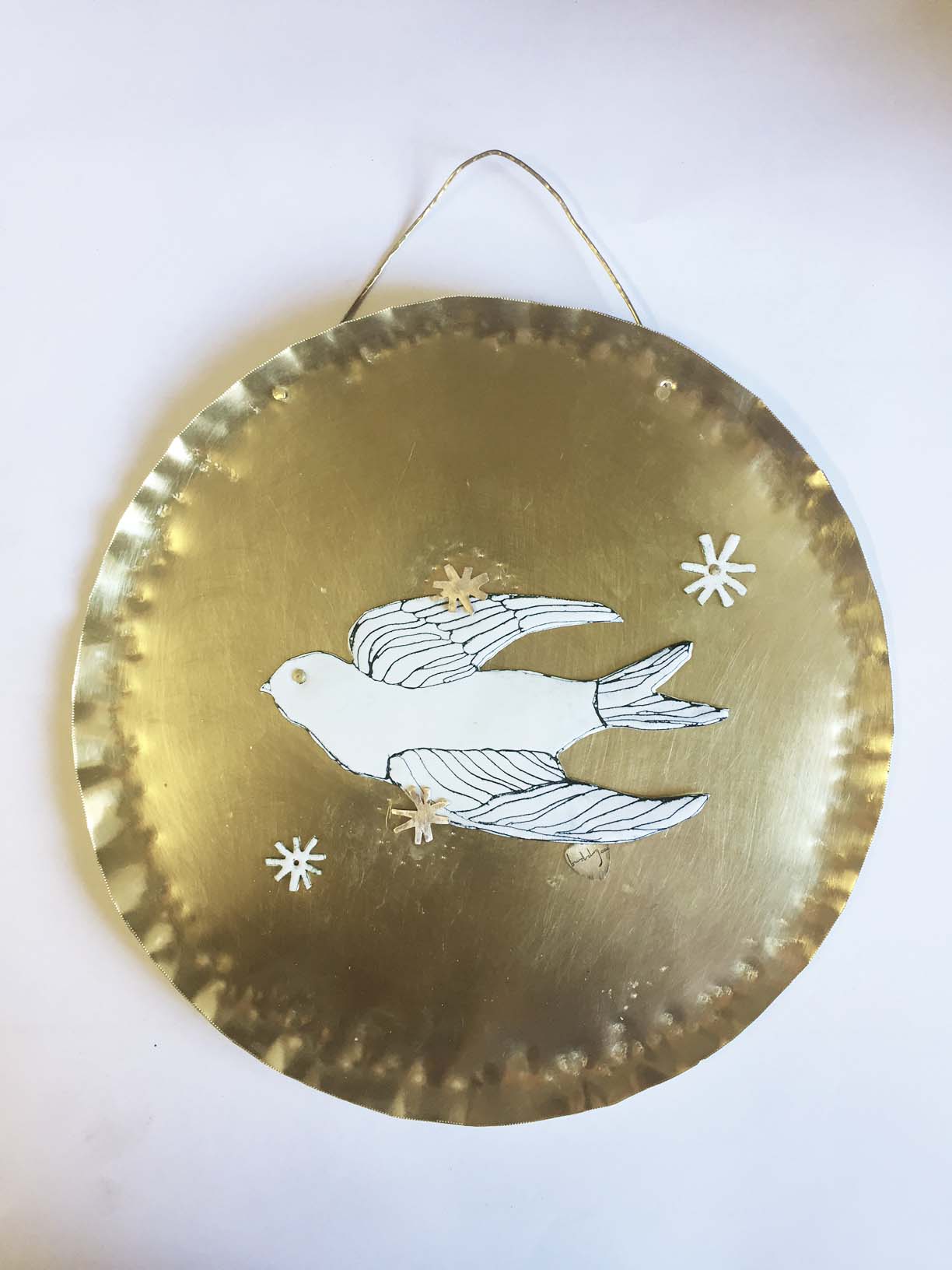 Riveted the bird with hand -cut metal stars, it took a lot of time placing the stars!