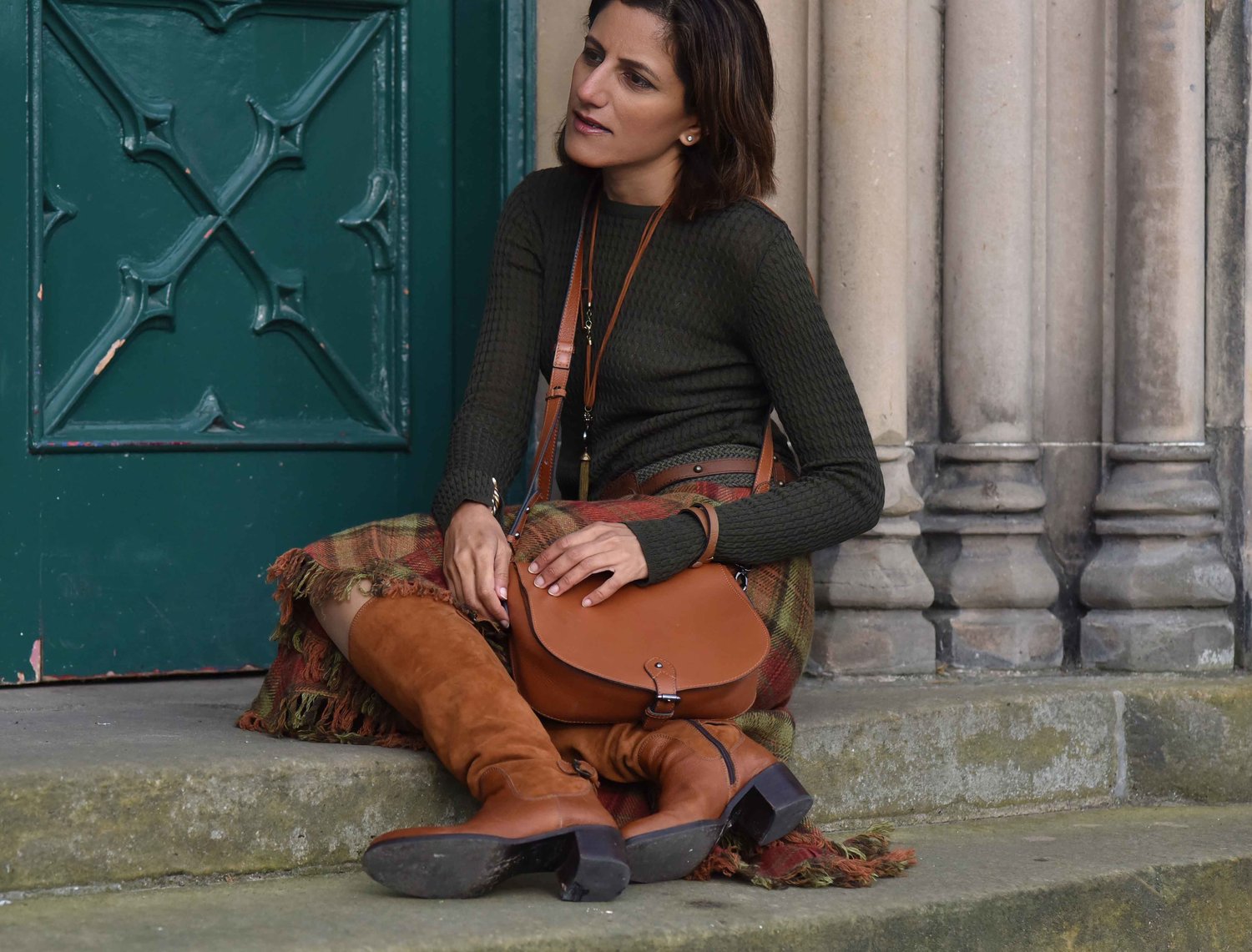 Ralph Lauren Blue Label plaid uneven hem skirt, tan Clarks bag, tan boots, Inverness, Scotland. Image©thingstodot.com
