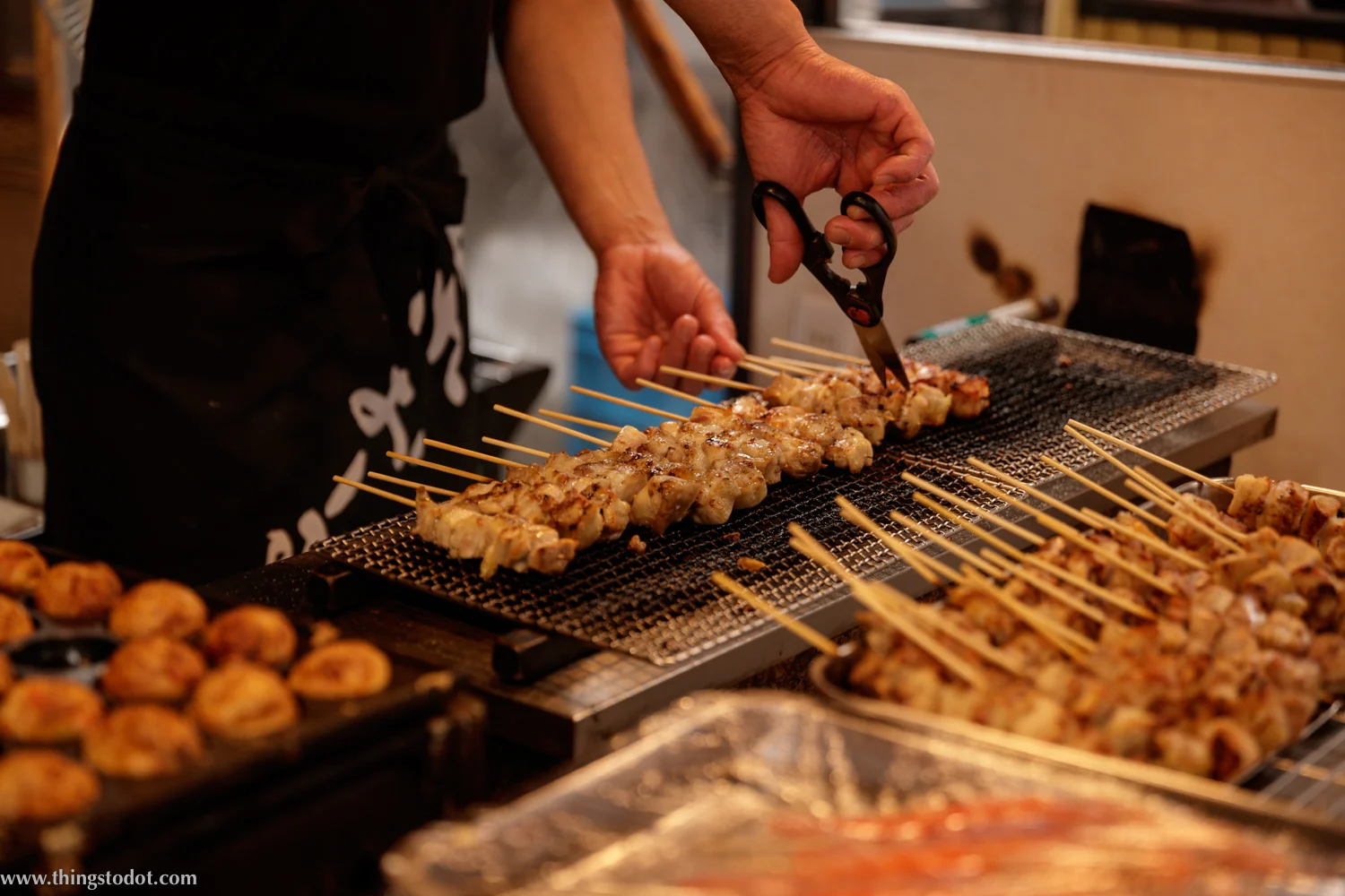 Street food, Dotonbori, Osaka, Japan. Photo: Kosuke Arakawa, www.kosukearakawa.com. Image©www.thingstodot.com.