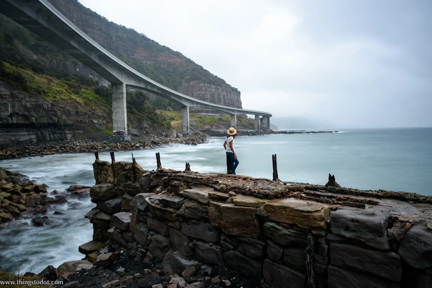 Sea Cliff Bridge, Coalcliff, New South Wales, Australia. Photo: Brad Chilby (http://chilby.com.au). Image©www.thingstodot.com. Clothing: https://www.cream-clothing.com.