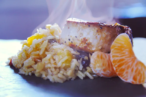 Pork Chops with Raisin, Almond, and Clementine Rice