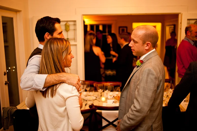 Groom socializing with guests in Oakland, CA