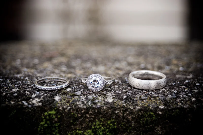 Wedding rings on moss covered stone