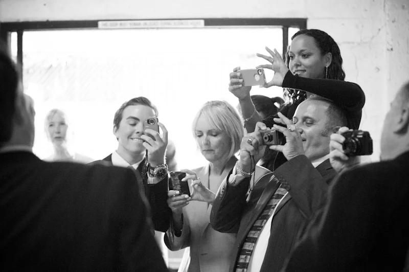 Group of people taking photos at Axis Cafe in San Francisco