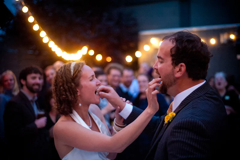 Bride and Groom eating cupcakes at Axis Cafe