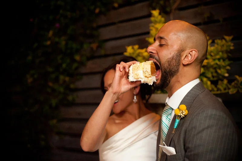 Bride feeding groom wedding cake