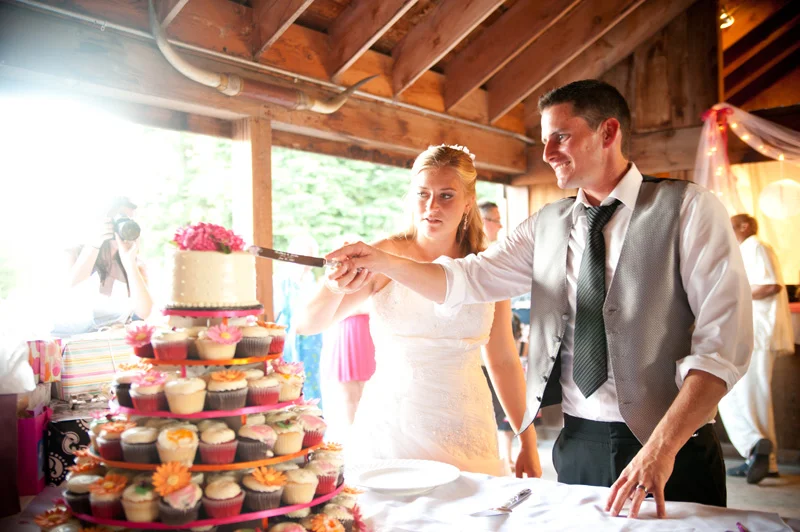Bride and groom cutting cake