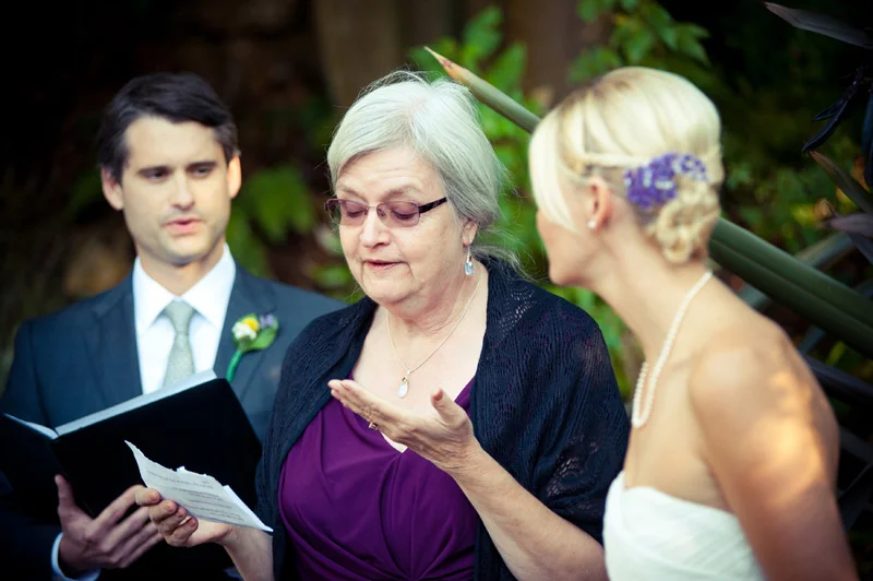 Mother of bride speaking at wedding ceremony in Oakland