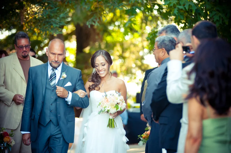 Bride walking down aisle at the Vine Hill House in Sebastapol, CA