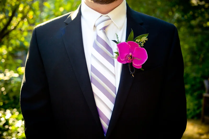 Detail of groom with orchid boutonniere at Oakland Wedding