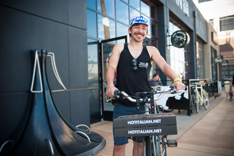 Portrait of bike messenger delivering pizza in Emeryville, CA