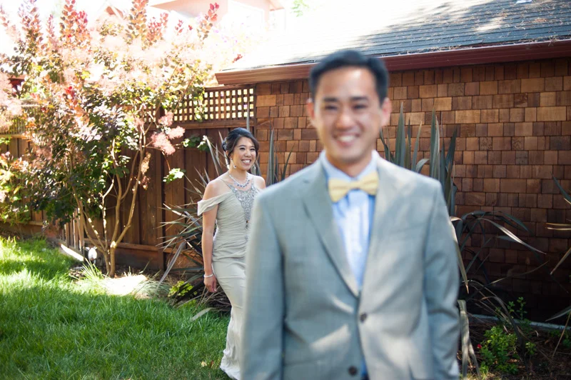 Bride and Groom during first look in Berkeley backyard