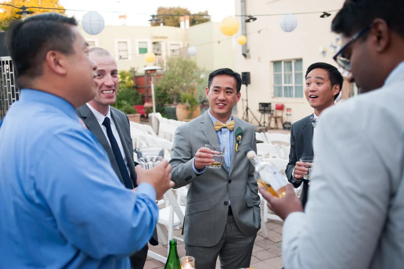 Groom toasting with friends in Oakland
