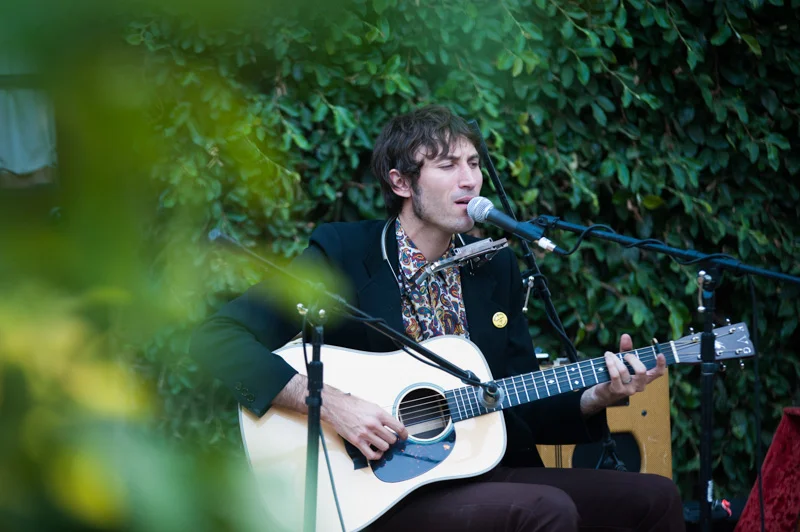 Matt Costa performing at house wedding