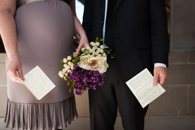 Detail of Bride and Groom holding hands and vows