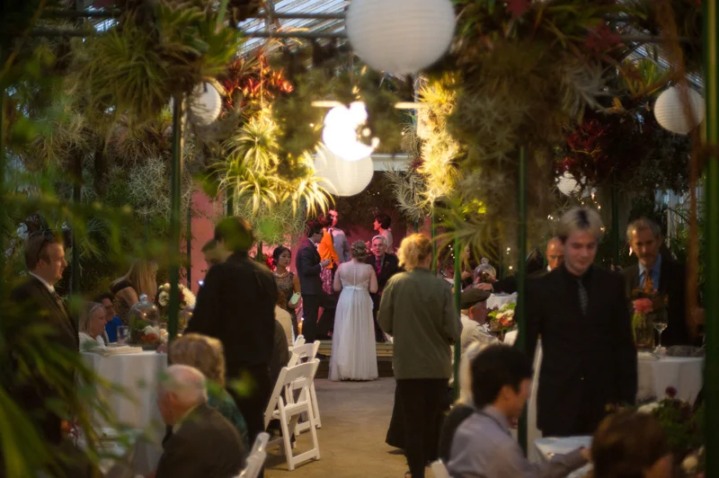 Wedding reception inside greenhouse