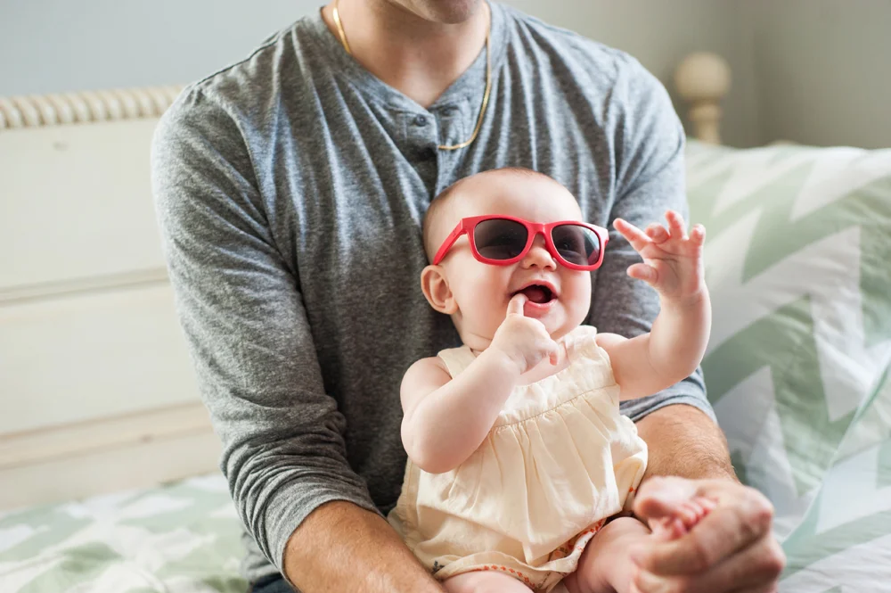 Funny candid of baby wearing sunglasses