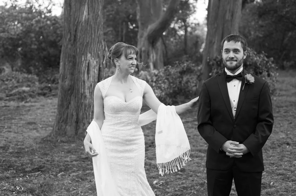 Bride seeing groom for the first time during first look in Golden Gate Park