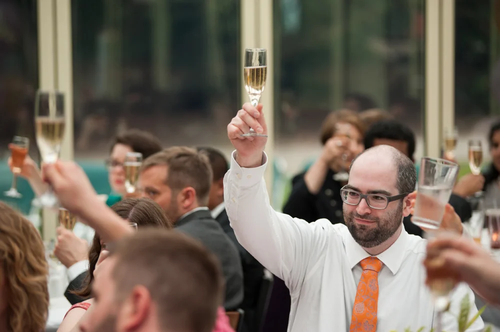 Guests raising theirs glasses