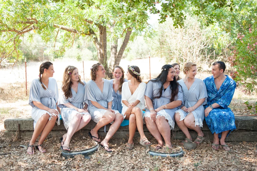 Candid photo of bride and bridesmaids in bathrobes