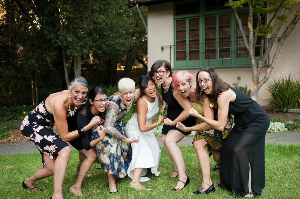 Portrait of bride and her friends flexing muscles at UC Berkeley