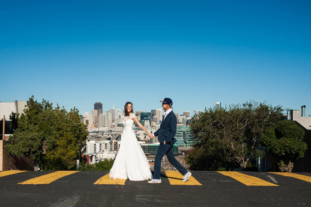 Just married couple walking across street in San Francisco