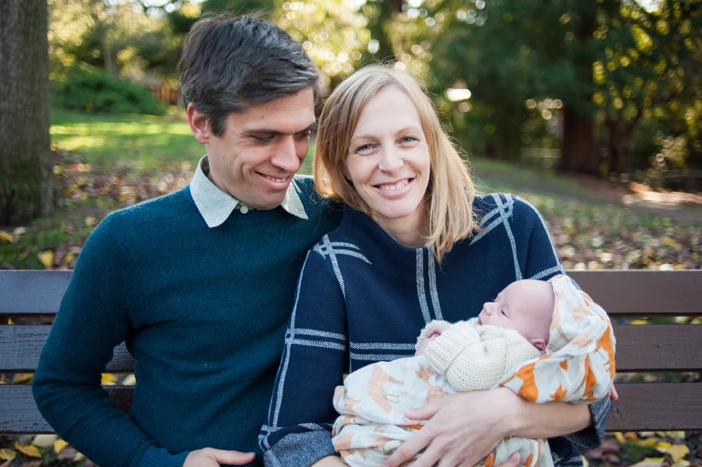 Portrait of mother and father with baby number 3