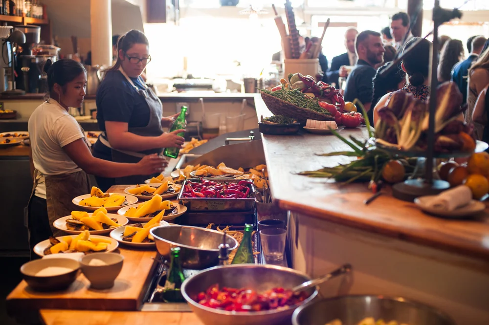 Restaurant staff preparing food for Pizzaiolo wedding