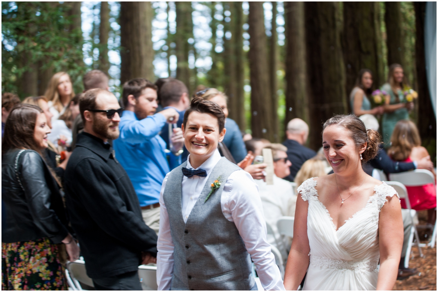 Married couple walking down the aisle in the redwoods