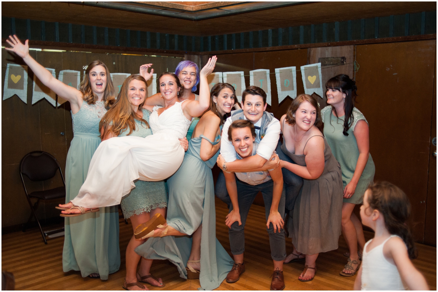 Wedding party holding bride at Sequoia Lodge